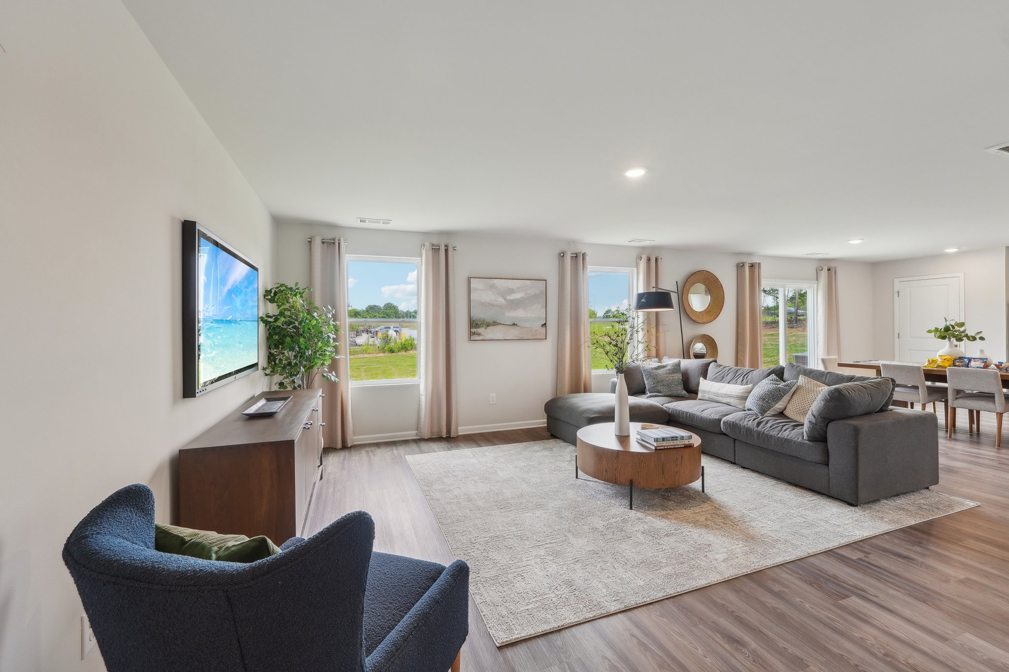 A living room with a large tv.