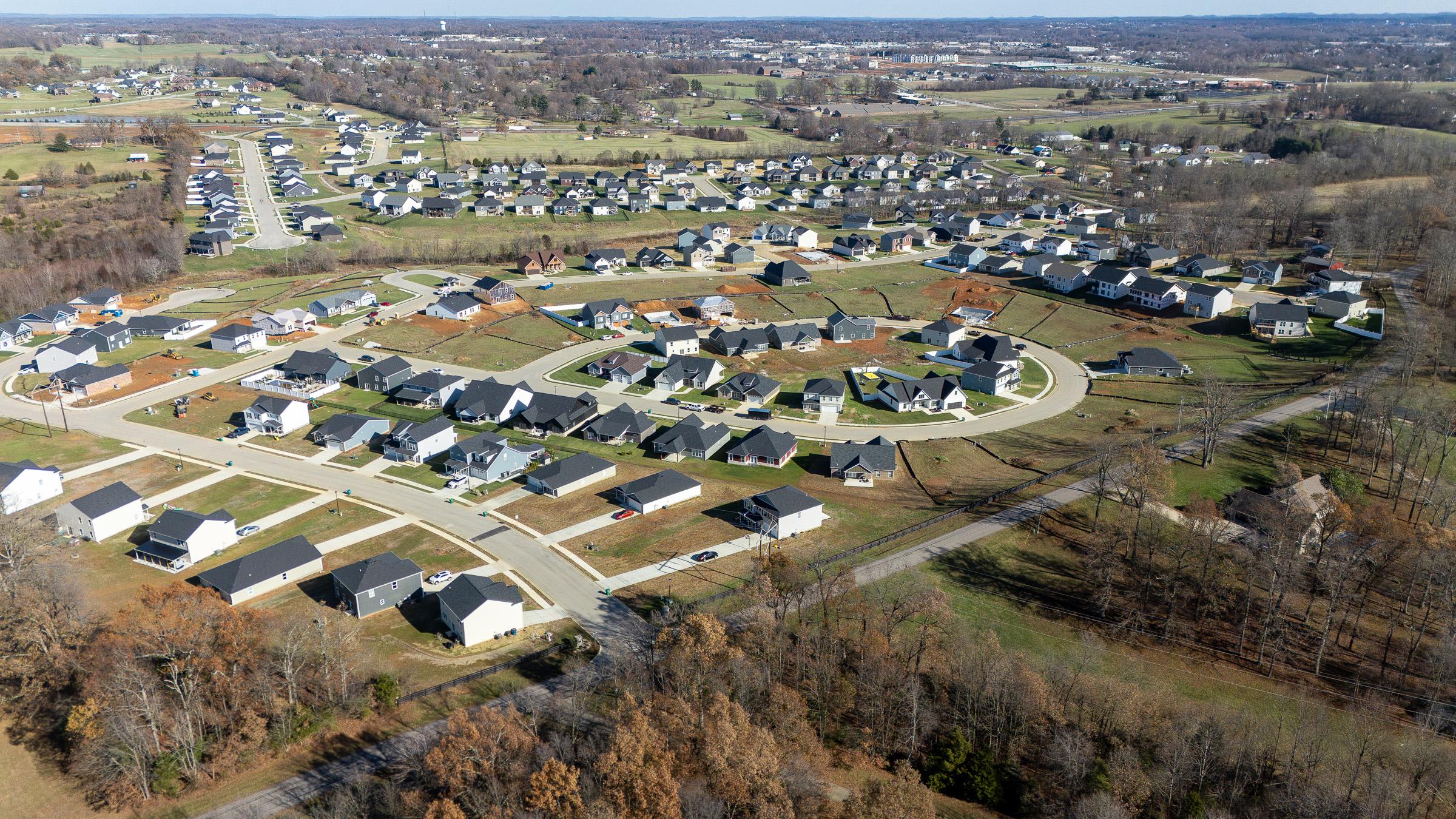 A group of houses in a field.