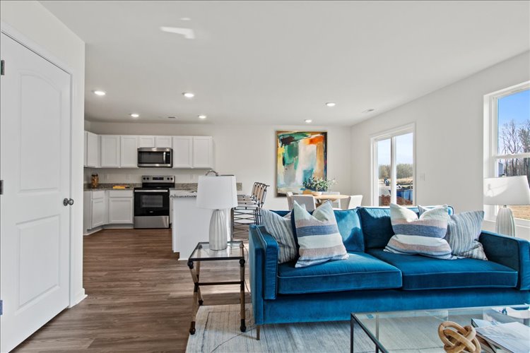 A living room with a blue couch.