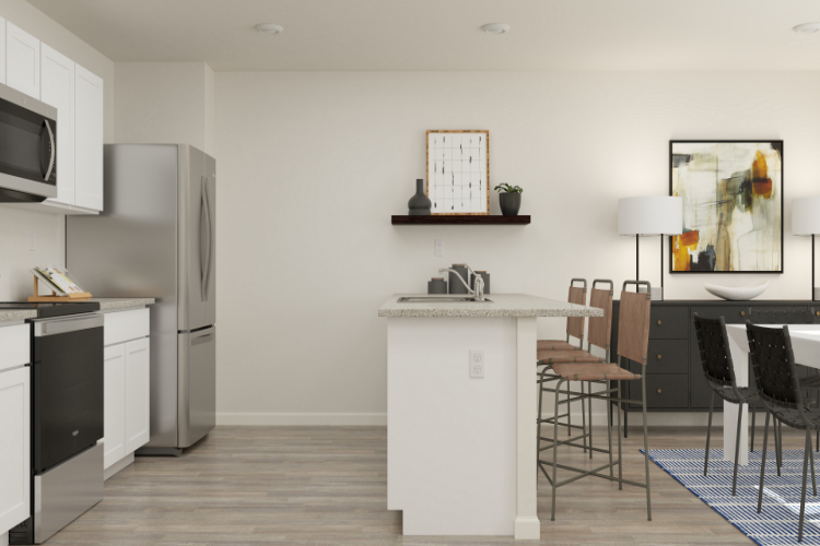 A kitchen with a table and chairs.