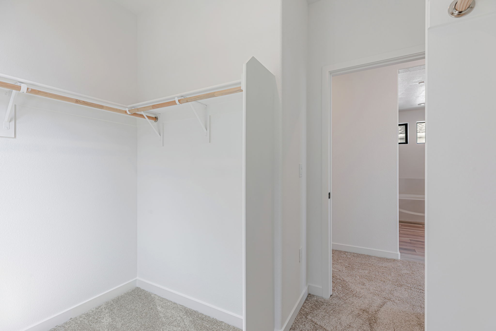 A hallway with white walls.