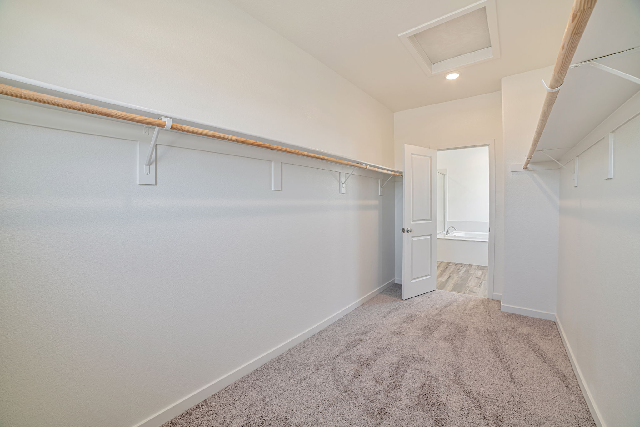 A hallway with white walls.