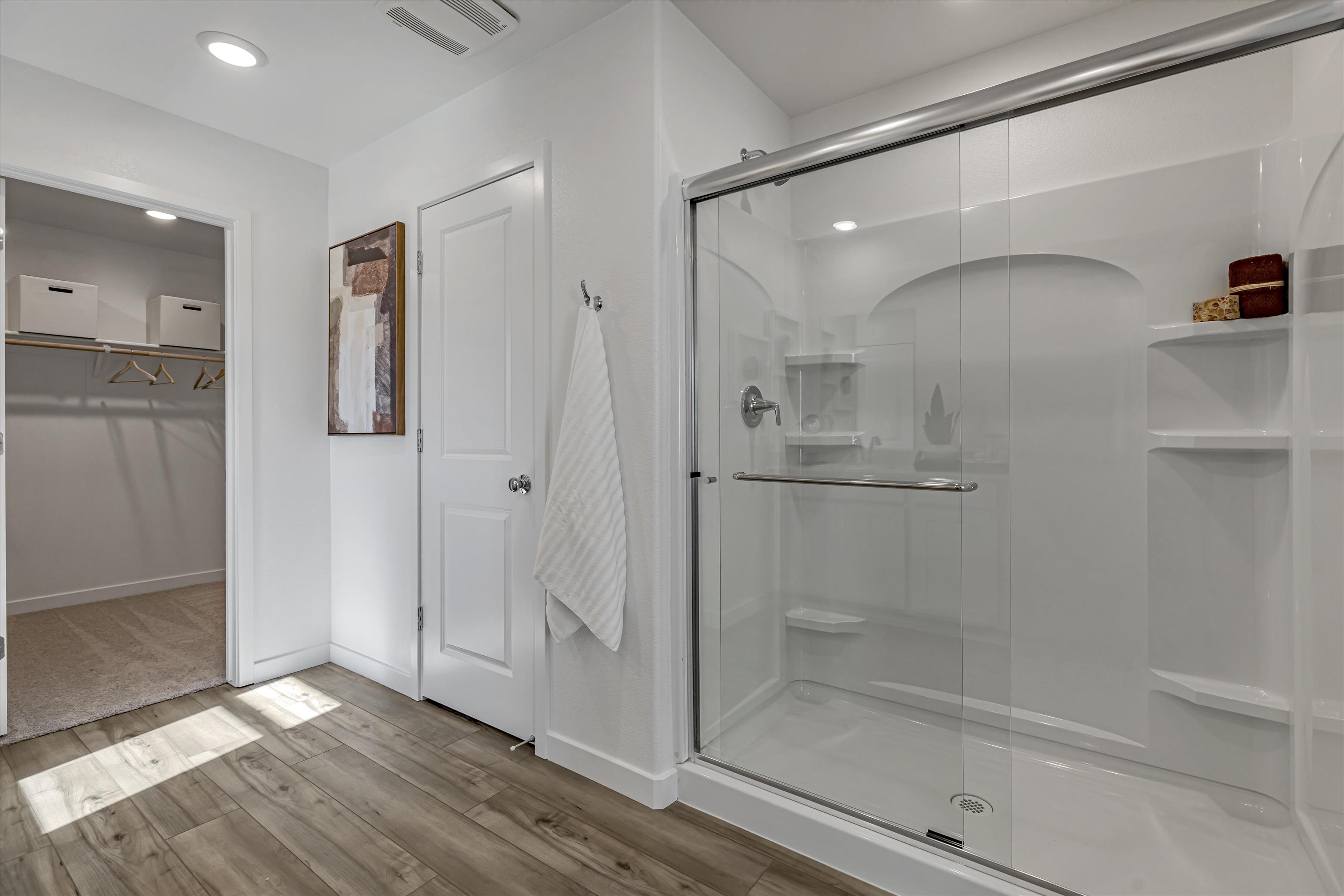 A bathroom with a glass shower.